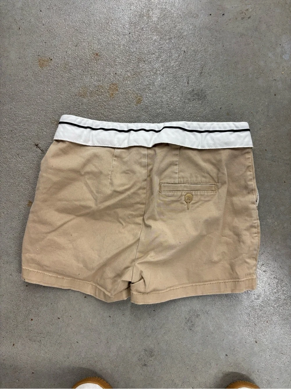 khaki skort with white trim